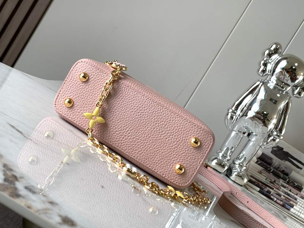 special gradeM20845 Grapefruit Pink Floral TricotThis Capucines mini handbag is a soft and feminine piece a Taurillon leather body with a light-colored flap and top handle, and an enameled Monogram floral chain that can 