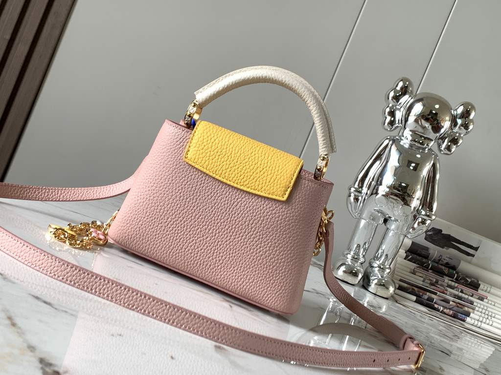 special gradeM20845 Grapefruit Pink Floral TricotThis Capucines mini handbag is a soft and feminine piece a Taurillon leather body with a light-colored flap and top handle, and an enameled Monogram floral chain that can 