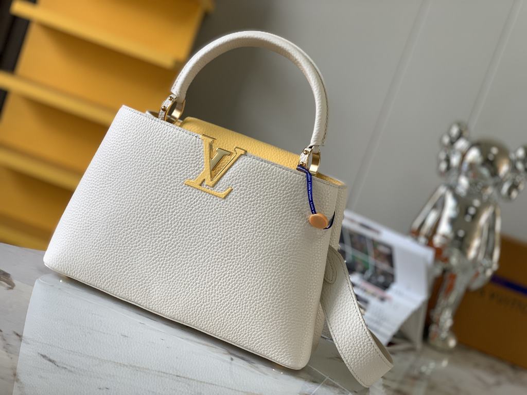 M59466 Pearl White with Pale Gold Buckle]A modern clash of shades in full-grain cowhide leather, this medium Capucines bag features the iconic LV alphabet and side loops, top handles and a detachable shoulder strap for v