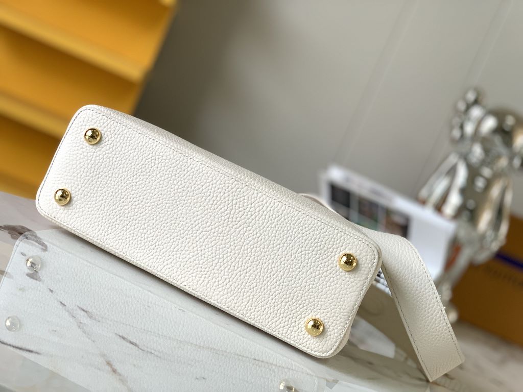 M59466 Pearl White with Pale Gold Buckle]A modern clash of shades in full-grain cowhide leather, this medium Capucines bag features the iconic LV alphabet and side loops, top handles and a detachable shoulder strap for v