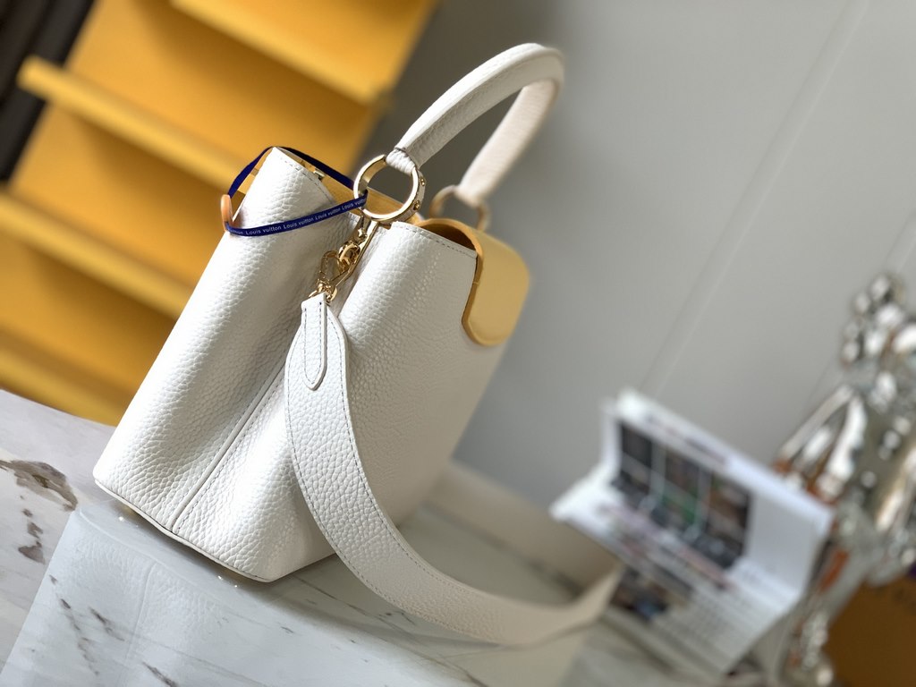 M59466 Pearl White with Pale Gold Buckle]A modern clash of shades in full-grain cowhide leather, this medium Capucines bag features the iconic LV alphabet and side loops, top handles and a detachable shoulder strap for v