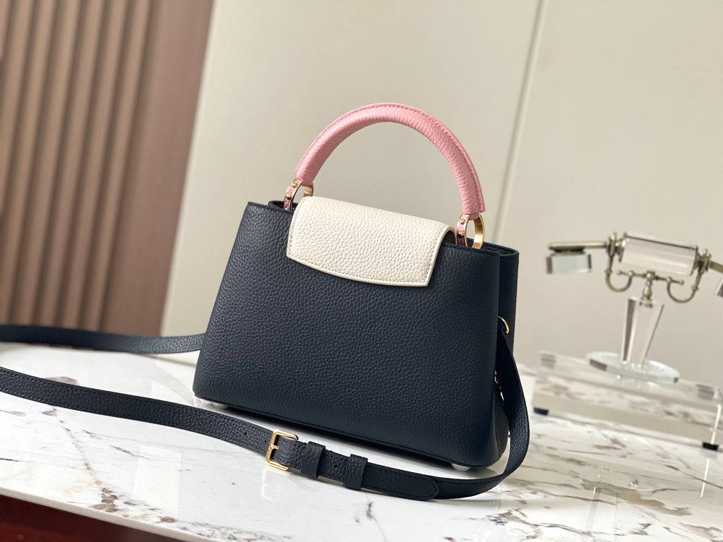 ExtraordinaryM20844 Black with Light Cherry Blossom Pink Floral TricotThis Capucines BB bag is made of Taurillon leather, with shades of the same color, making the classic shape even more striking. With an enameled Monog