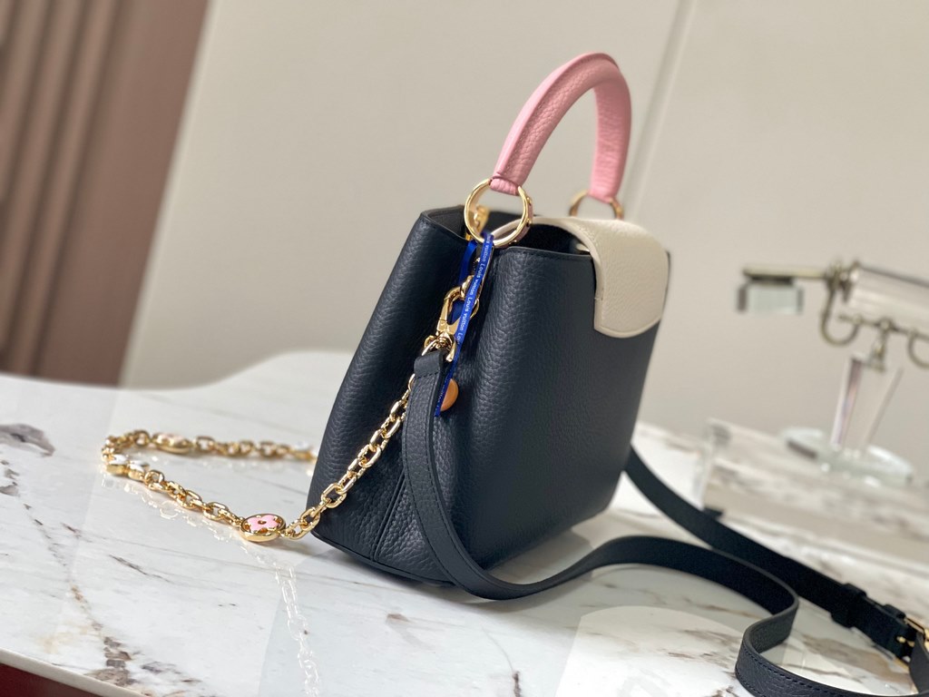 ExtraordinaryM20844 Black with Light Cherry Blossom Pink Floral TricotThis Capucines BB bag is made of Taurillon leather, with shades of the same color, making the classic shape even more striking. With an enameled Monog