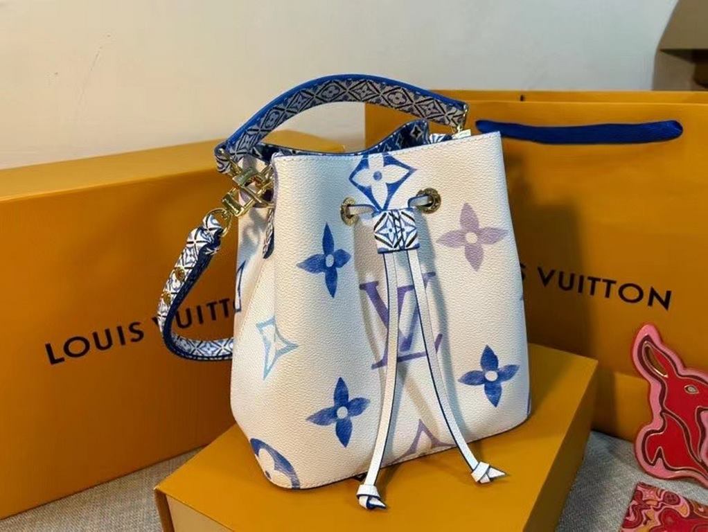 The new M22986 NeoNoé Bucket Bag in blue is made of muted canvas with a Giant Monogram print, giving the LV and Monogram florals a watercolor effect in varying shades, and features a drawstring and central snap closure i