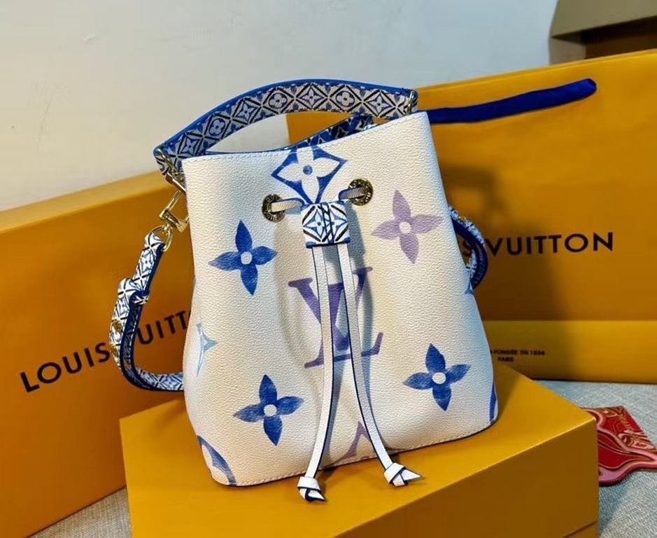 The new M22986 NeoNoé Bucket Bag in blue is made of muted canvas with a Giant Monogram print, giving the LV and Monogram florals a watercolor effect in varying shades, and features a drawstring and central snap closure i