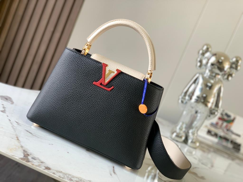 M59465 Black with Pearl Platinum Buckle]A modern clash of shades in full-grain cowhide leather, this Capucines BB bag features the iconic LV alphabet and side loops, top handles and a detachable shoulder strap for versat