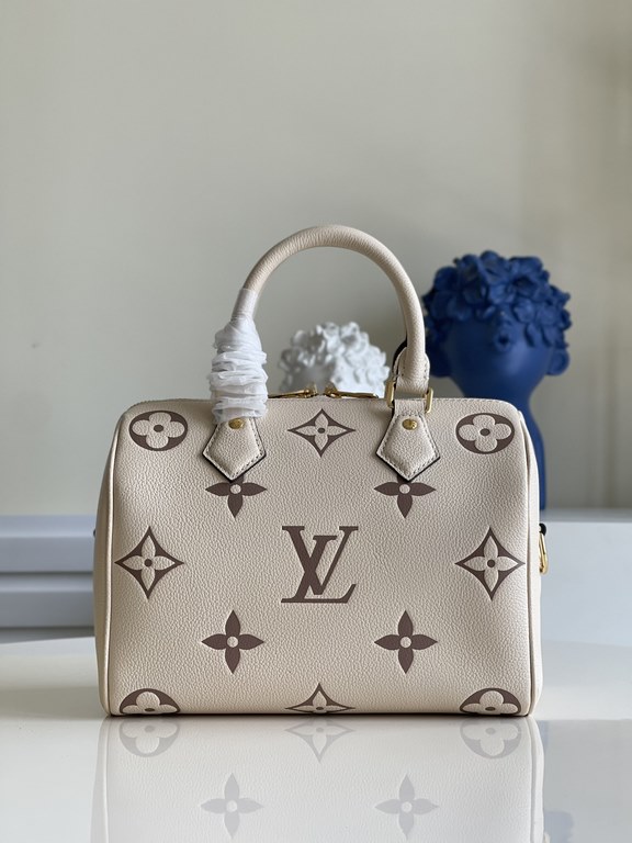 Exclusive to M58947] The Speedy Bandoulière 25 handbag from the Fall 2021 Wild at Heart capsule collection features oversized LV letters embossed in Monogram Empreinte leather and a detachable shoulder strap for a crossb