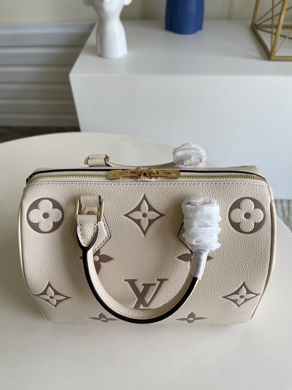 Exclusive to M58947] The Speedy Bandoulière 25 handbag from the Fall 2021 Wild at Heart capsule collection features oversized LV letters embossed in Monogram Empreinte leather and a detachable shoulder strap for a crossb