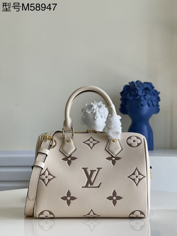 Exclusive to M58947] The Speedy Bandoulière 25 handbag from the Fall 2021 Wild at Heart capsule collection features oversized LV letters embossed in Monogram Empreinte leather and a detachable shoulder strap for a crossb