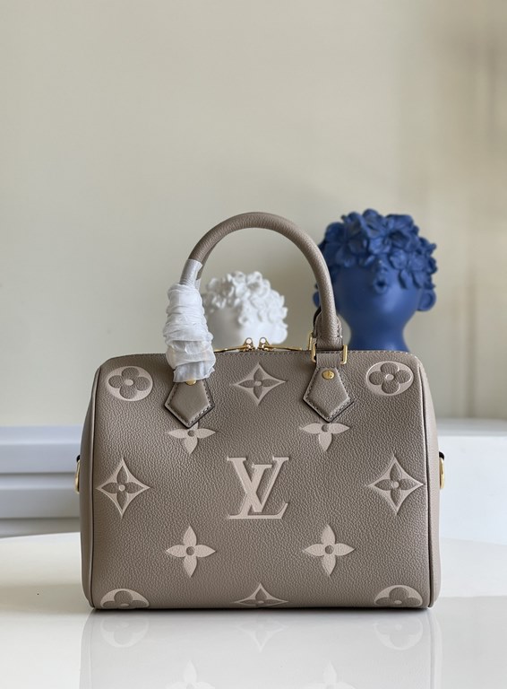 Exclusive to M58947] The Speedy Bandoulière 25 handbag from the Fall 2021 Wild at Heart capsule collection features oversized LV letters embossed in Monogram Empreinte leather and a detachable shoulder strap for a crossb