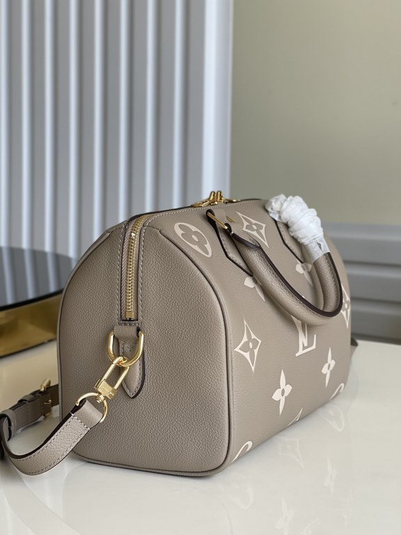 Exclusive to M58947] The Speedy Bandoulière 25 handbag from the Fall 2021 Wild at Heart capsule collection features oversized LV letters embossed in Monogram Empreinte leather and a detachable shoulder strap for a crossb