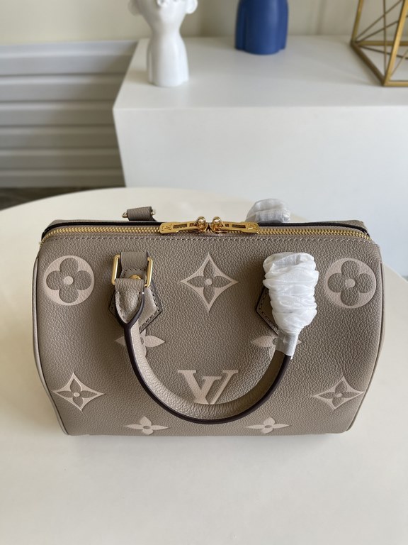 Exclusive to M58947] The Speedy Bandoulière 25 handbag from the Fall 2021 Wild at Heart capsule collection features oversized LV letters embossed in Monogram Empreinte leather and a detachable shoulder strap for a crossb