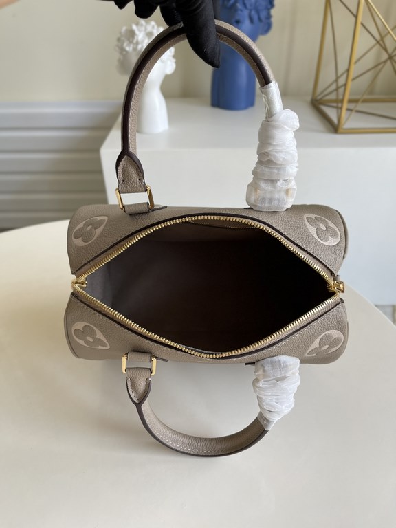 Exclusive to M58947] The Speedy Bandoulière 25 handbag from the Fall 2021 Wild at Heart capsule collection features oversized LV letters embossed in Monogram Empreinte leather and a detachable shoulder strap for a crossb