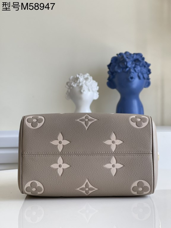 Exclusive to M58947] The Speedy Bandoulière 25 handbag from the Fall 2021 Wild at Heart capsule collection features oversized LV letters embossed in Monogram Empreinte leather and a detachable shoulder strap for a crossb