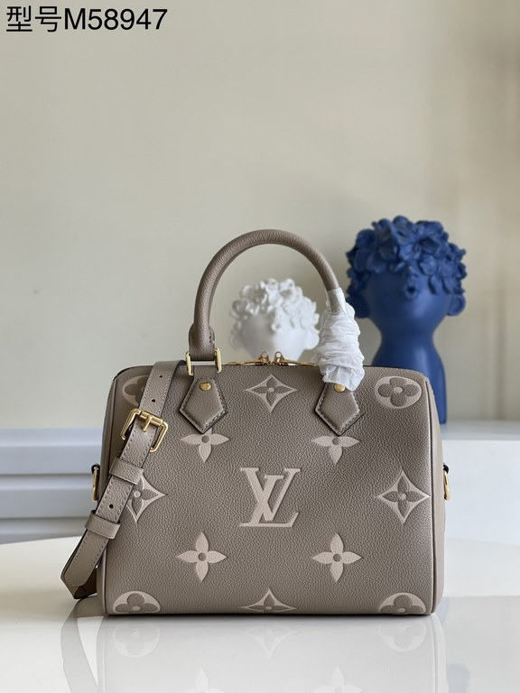 Exclusive to M58947] The Speedy Bandoulière 25 handbag from the Fall 2021 Wild at Heart capsule collection features oversized LV letters embossed in Monogram Empreinte leather and a detachable shoulder strap for a crossb