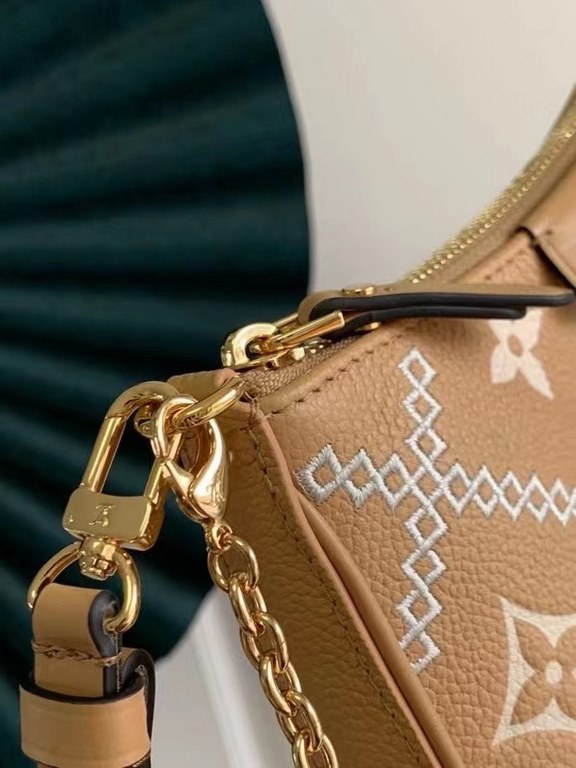 SpecialtyM81066 M80349 The Spring 2022 Easy Pouch On Strap is crafted from Monogram Empreinte leather with Monogram embossing and a soft texture. The chain and adjustable leather shoulder strap make it easy to carry on t