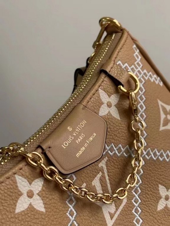 SpecialtyM81066 M80349 The Spring 2022 Easy Pouch On Strap is crafted from Monogram Empreinte leather with Monogram embossing and a soft texture. The chain and adjustable leather shoulder strap make it easy to carry on t