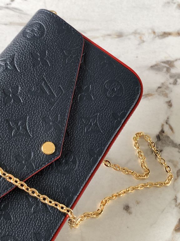 Top M64099 NavyThe Pochette Félicie chain bag is shaped like an envelope in Monogram Empreinte leather and embossed with the classic Monogram pattern. The ample compartments are complemented by a removable zipper pocket 