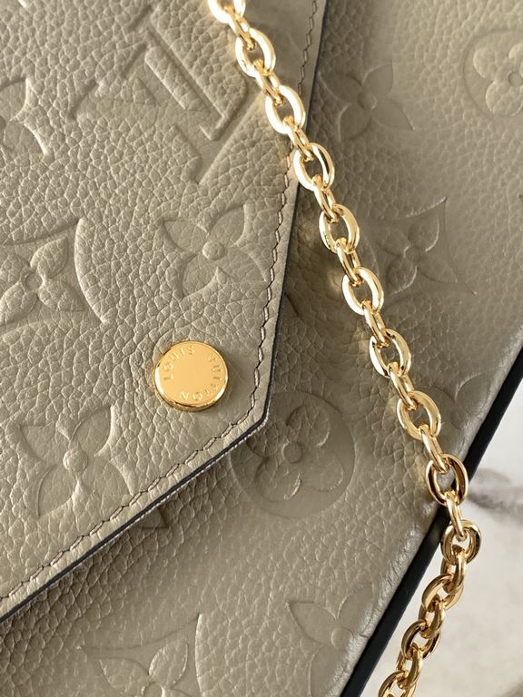 Top M68697 Elephant GrayThe Pochette Félicie chain bag is shaped like an envelope in Monogram Empreinte leather and embossed with the classic Monogram pattern. The ample compartments are complemented by a removable zippe