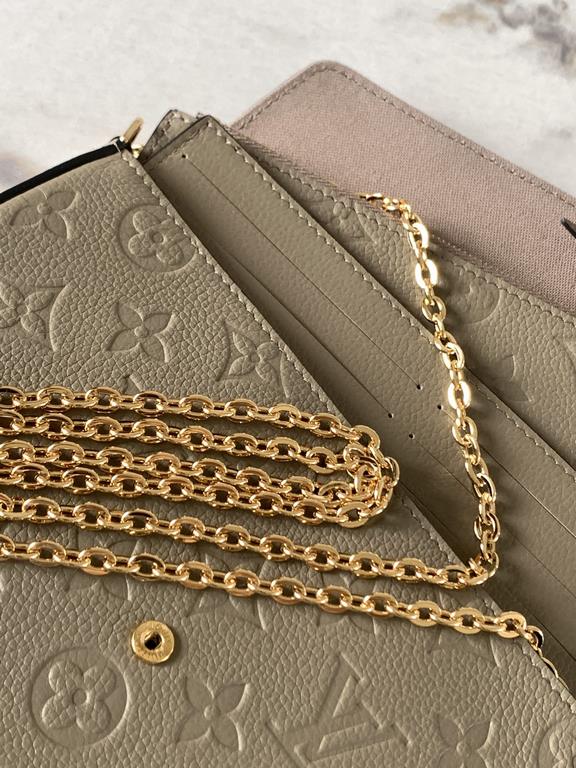 Top M68697 Elephant GrayThe Pochette Félicie chain bag is shaped like an envelope in Monogram Empreinte leather and embossed with the classic Monogram pattern. The ample compartments are complemented by a removable zippe