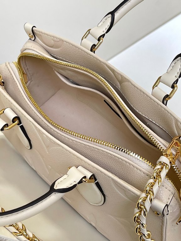 M23698 OnTheGo East West Handbag in Cream ColorIntroducing the Ays OnTheGo small tote bag design, the East West's ample shape is reinvented in Monogram Empreinte leather with a Giant Monogram embossed on the leather body