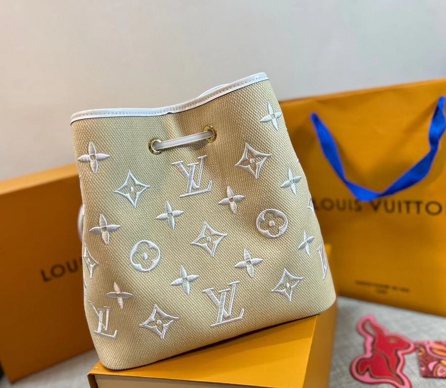 M23080 White, 22852 Louis Vuitton's beloved bucket bag welcomes the summer season. Embroidered with a Monogram pattern on raffia-soft cotton, it's a sophisticated companion for beach days, poolside lounging and cocktail 