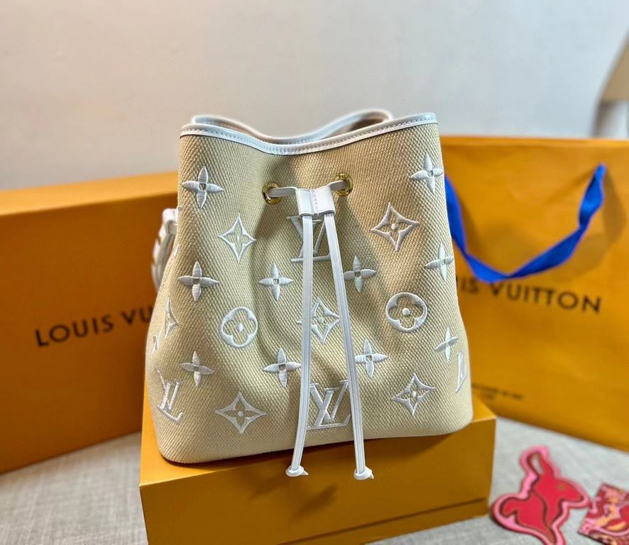 M23080 White, 22852 Louis Vuitton's beloved bucket bag welcomes the summer season. Embroidered with a Monogram pattern on raffia-soft cotton, it's a sophisticated companion for beach days, poolside lounging and cocktail 