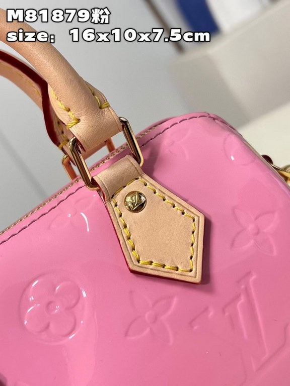 M81879 in pink patent leather! The Nano Speedy is a distillation of Louis Vuitton's classic Speedy configuration in Monogram Vernis-embossed patent cowhide with cowhide detailing and metal hardware. The handles and detac