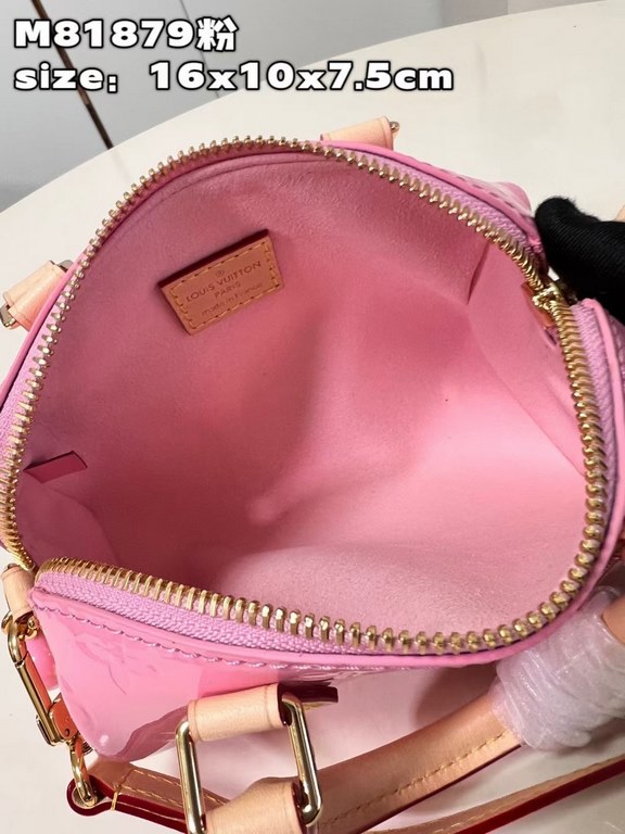 M81879 in pink patent leather! The Nano Speedy is a distillation of Louis Vuitton's classic Speedy configuration in Monogram Vernis-embossed patent cowhide with cowhide detailing and metal hardware. The handles and detac