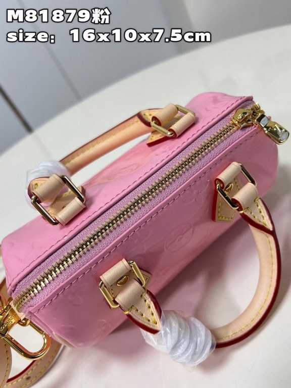 M81879 in pink patent leather! The Nano Speedy is a distillation of Louis Vuitton's classic Speedy configuration in Monogram Vernis-embossed patent cowhide with cowhide detailing and metal hardware. The handles and detac