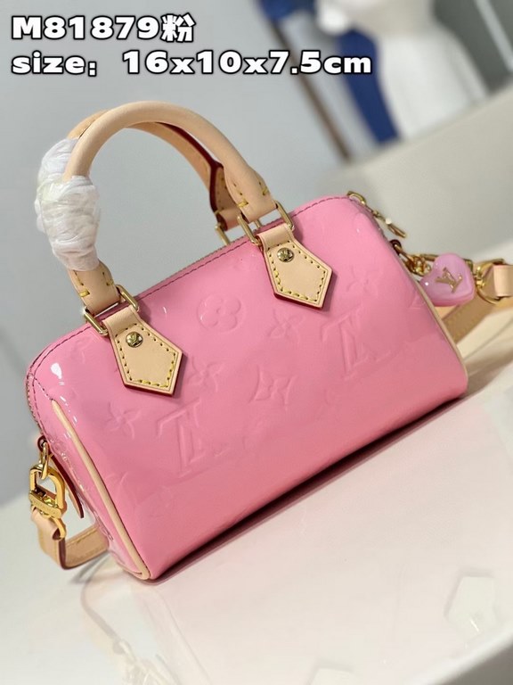 M81879 in pink patent leather! The Nano Speedy is a distillation of Louis Vuitton's classic Speedy configuration in Monogram Vernis-embossed patent cowhide with cowhide detailing and metal hardware. The handles and detac