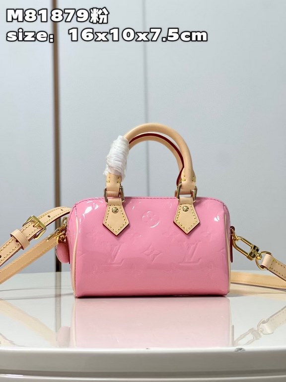 M81879 in pink patent leather! The Nano Speedy is a distillation of Louis Vuitton's classic Speedy configuration in Monogram Vernis-embossed patent cowhide with cowhide detailing and metal hardware. The handles and detac