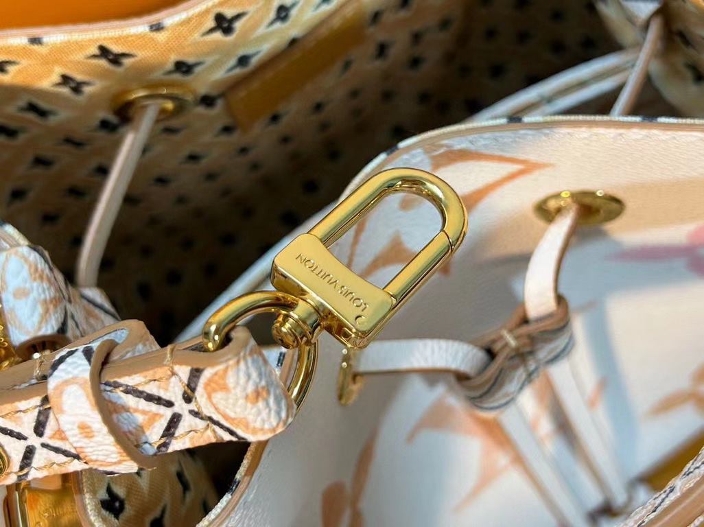 M22985 Apricot Bucket Bag Collection Seasonal New NéONOé BB Handbags This NeoNoé bucket bag is made of muted canvas depicting the Giant Monogram print, which gives shades of watercolor to the LV and Monogram florals, and