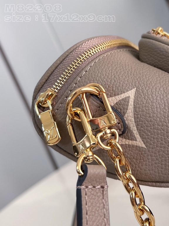 Exclusive M82208 silk-screened in light gray] Louis Vuitton's soft take on the trendy fanny pack design, the Mini Bumbag is crafted from Monogram Empreinte leather and features a zippered main compartment and zippered po