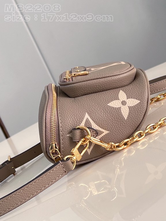 Exclusive M82208 silk-screened in light gray] Louis Vuitton's soft take on the trendy fanny pack design, the Mini Bumbag is crafted from Monogram Empreinte leather and features a zippered main compartment and zippered po