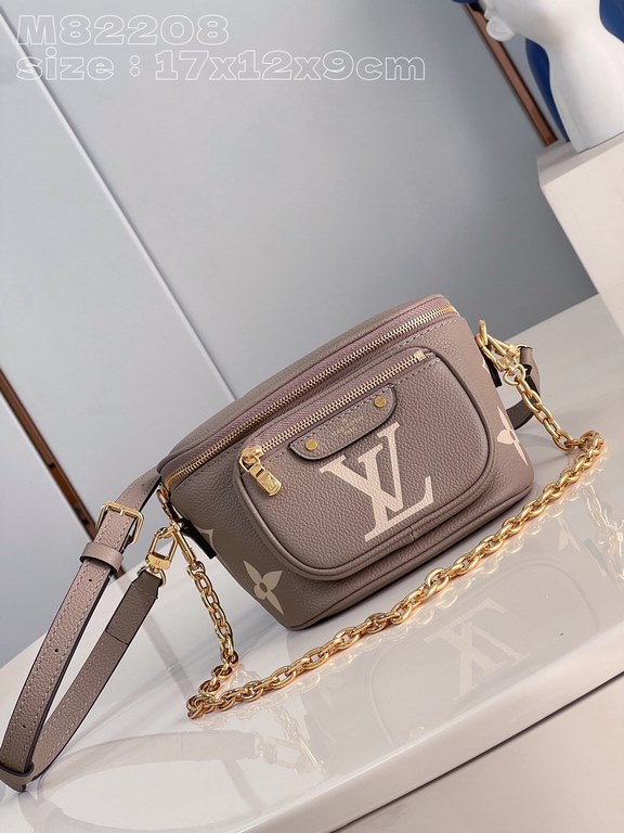 Exclusive M82208 silk-screened in light gray] Louis Vuitton's soft take on the trendy fanny pack design, the Mini Bumbag is crafted from Monogram Empreinte leather and features a zippered main compartment and zippered po