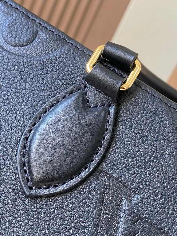 OnTheGo East West Handbag - Giant Monogram Empreinte LeatherIntroducing the Ays OnTheGo small tote bag design, the East West's ample shape is reinvented in Monogram Empreinte leather with a Giant Monogram embossed on the