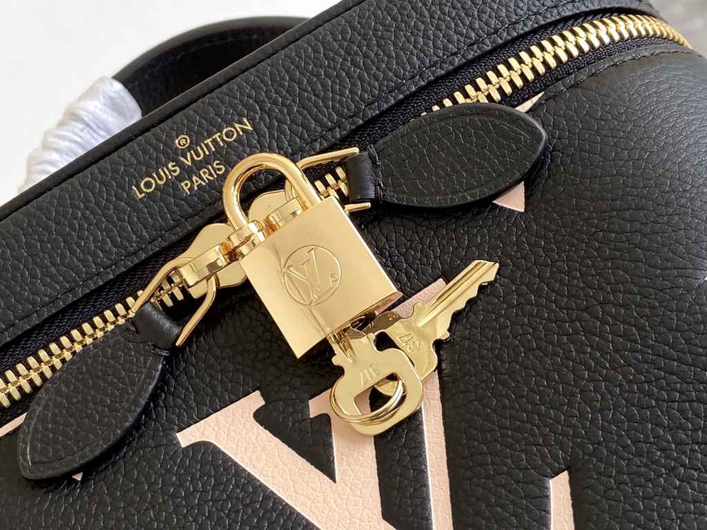 Top of the lineM45780 Black Embossed This Vanity pouch combines Giant Monogram embossing, an elegant shape and leather top handles. Leather tassels open the zipper with ease, and a padlock keeps it secure. The detachable