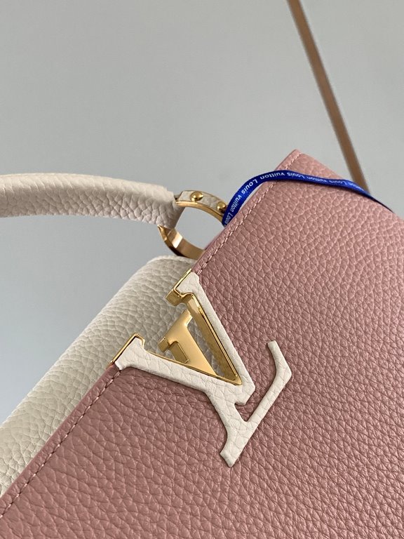 M59465 Rose Pink with Pearl Platinum Buckle]A modern clash of shades in full-grain cowhide leather, this Capucines BB bag features the iconic LV alphabet and side loops, top handles and a detachable shoulder strap for ve