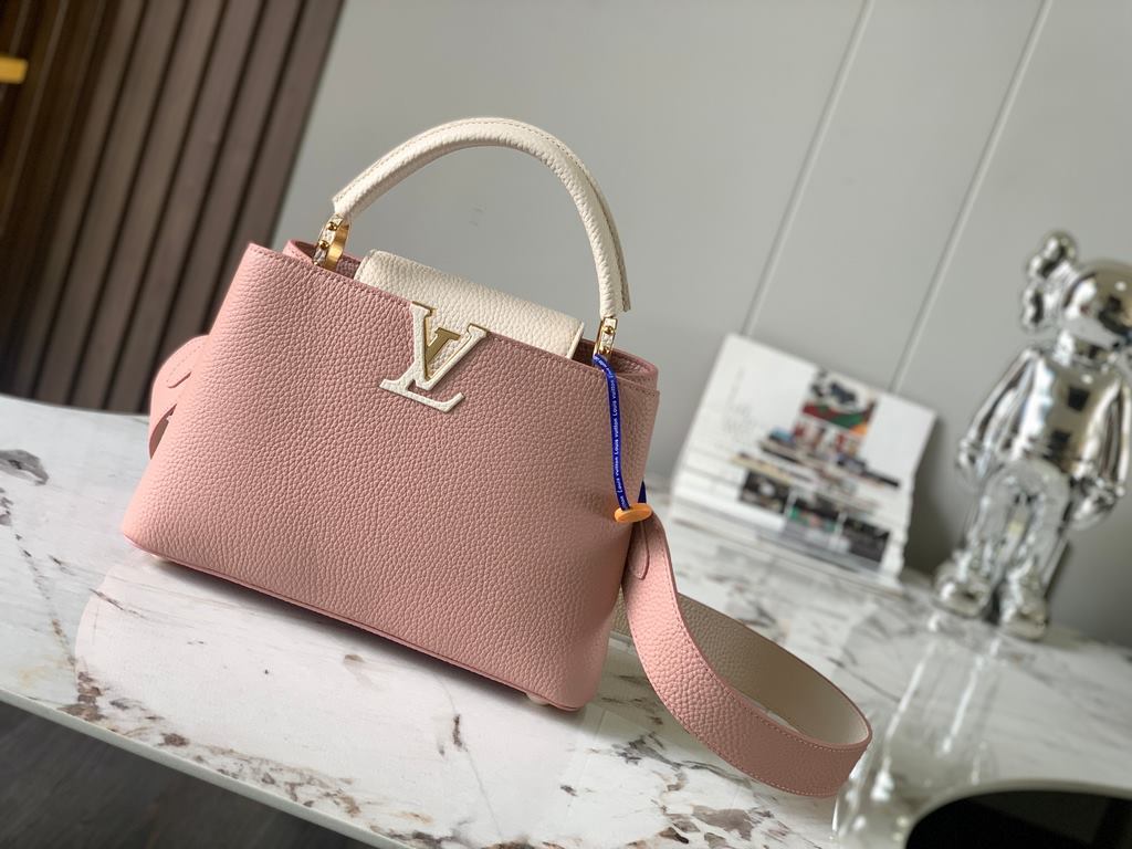 M59465 Rose Pink with Pearl Platinum Buckle]A modern clash of shades in full-grain cowhide leather, this Capucines BB bag features the iconic LV alphabet and side loops, top handles and a detachable shoulder strap for ve