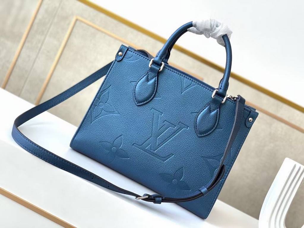 Top  M45653Blue M45661This Onthego mini shopper bag shows off the Monogram pattern to its best advantage, with large letters embossed on soft grained cowhide leather, an ample interior to hold a laptop and other office s