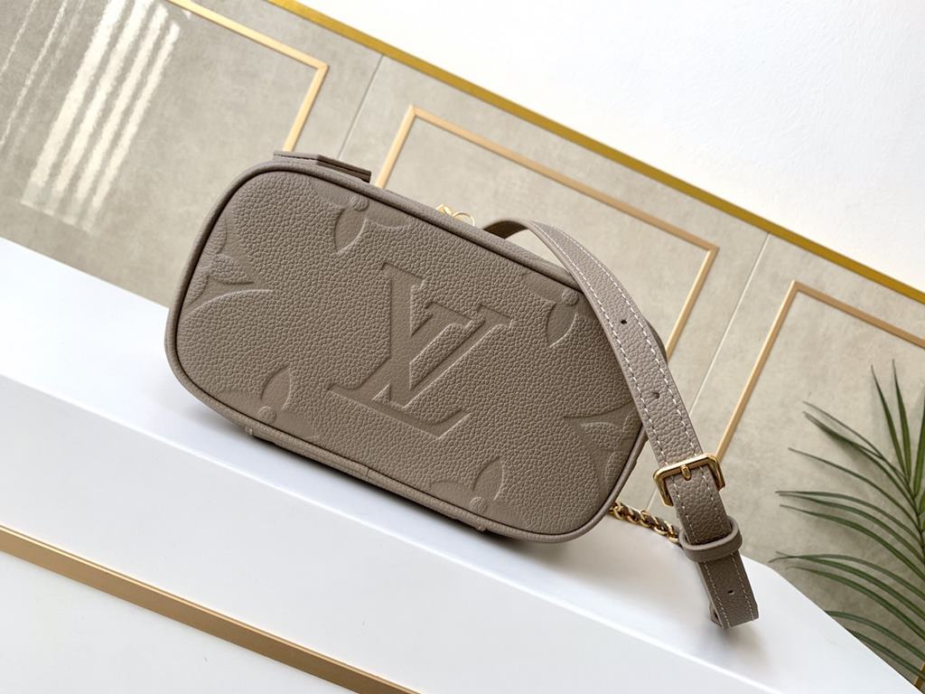 Top of the lineM45608 Embossed Elephant Gray This Vanity pouch combines Giant Monogram embossing, elegant shaping and leather top handles. Leather tassels open the zipper with ease and a padlock keeps it secure. The deta