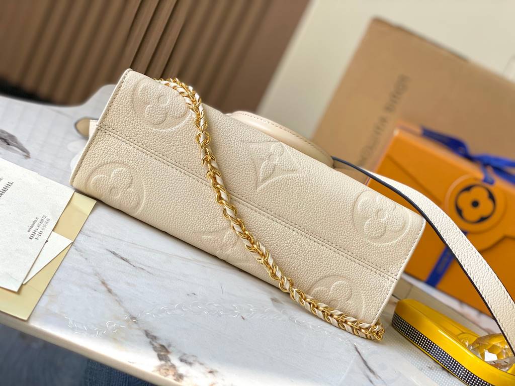 OnTheGo East West Handbag] [Extra Fine Original Leather   M23698 Milk WhiteIntroducing the Ays OnTheGo small tote bag design, the East West's ample shape is reimagined in Monogram Empreinte leather with a Giant Monogram 