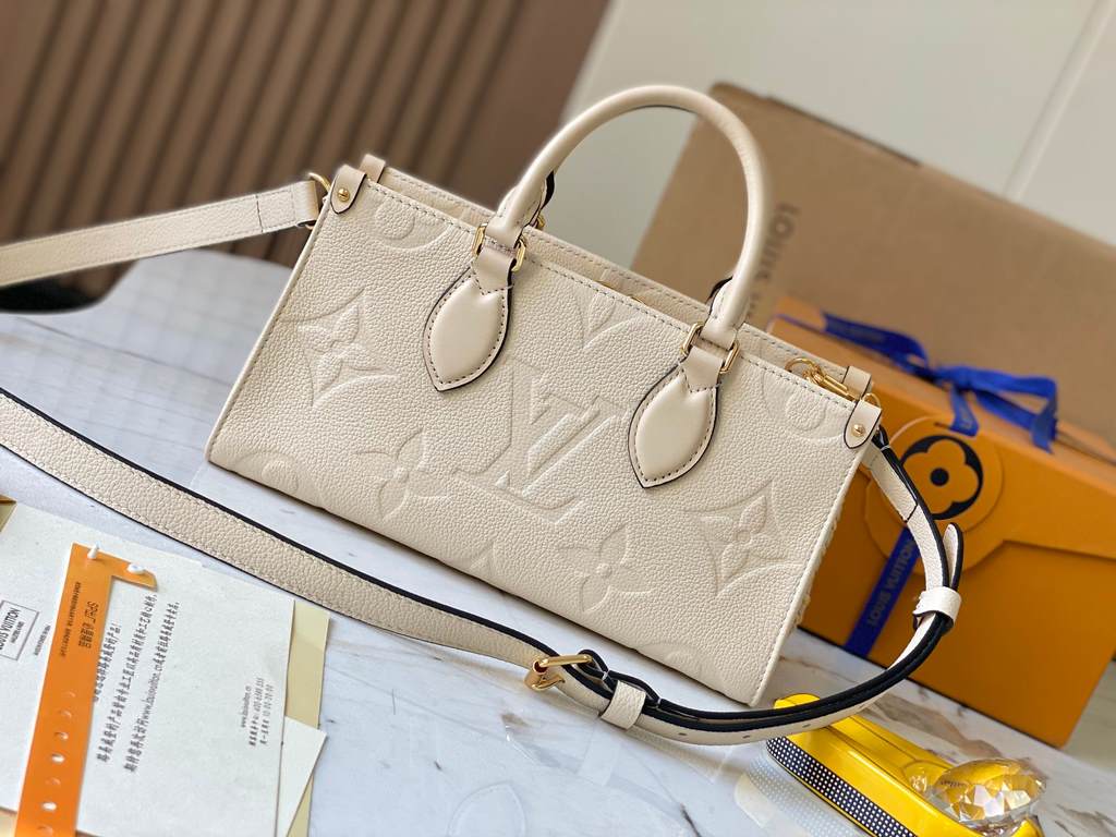 OnTheGo East West Handbag] [Extra Fine Original Leather   M23698 Milk WhiteIntroducing the Ays OnTheGo small tote bag design, the East West's ample shape is reimagined in Monogram Empreinte leather with a Giant Monogram 