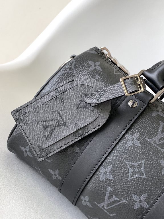 Top Original M46271 Black Flower Pillow Bag This Keepall 25 handbag is an elegant reinterpretation of Louis Vuitton's classic pattern in Monogram Eclipse Reverse canvas. Reinforced straps and a leather name plate continu