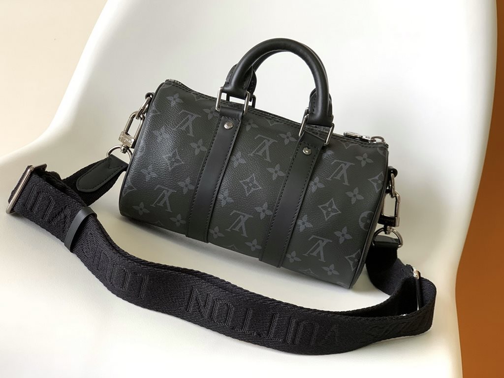 Top Original M46271 Black Flower Pillow Bag This Keepall 25 handbag is an elegant reinterpretation of Louis Vuitton's classic pattern in Monogram Eclipse Reverse canvas. Reinforced straps and a leather name plate continu