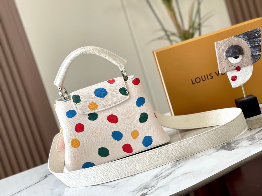 EXCLUSIVE SHOOTING - M21663 From the Louis Vuitton x Yayoi Kusama collaboration comes this LV x YK Capucines pouch. The renowned Japanese artist's childhood obsession with polka dots as a symbol of infinity finds dazzlin