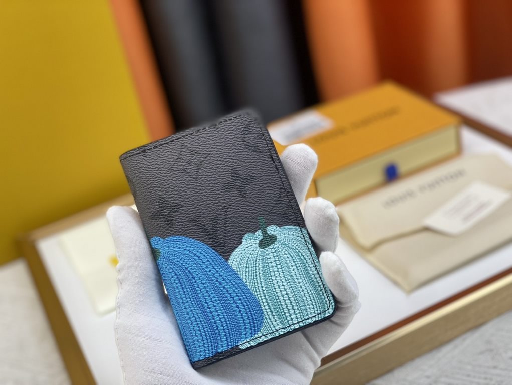 63144 Grey Flower Pumpkin   From the Louis Vuitton x Yayoi Kusama Collaboration, this LV x YK Pocket Money Clip features a colorful pumpkin motif on Monogram Eclipse Reverse canvas, recreating the symbol of warmth and so