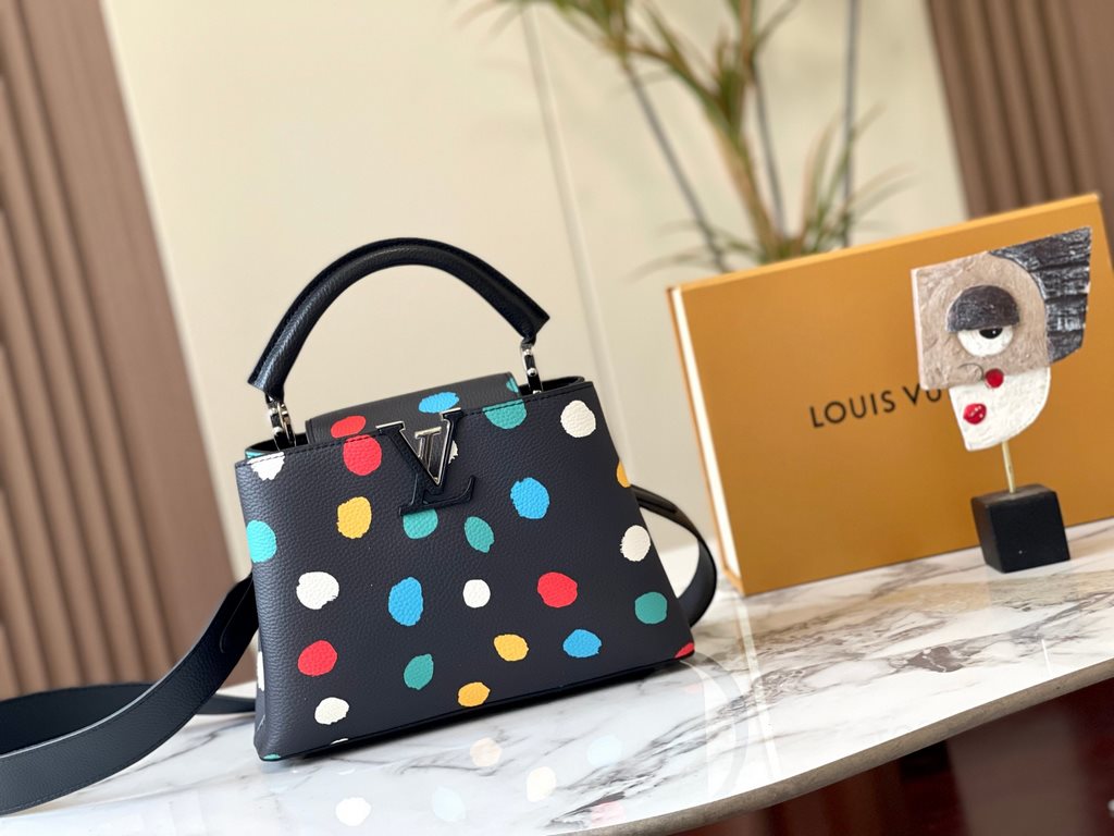 EXCLUSIVE SHOOTING - M21663 From the Louis Vuitton x Yayoi Kusama collaboration comes this LV x YK Capucines pouch. The renowned Japanese artist's childhood obsession with polka dots as a symbol of infinity finds dazzlin