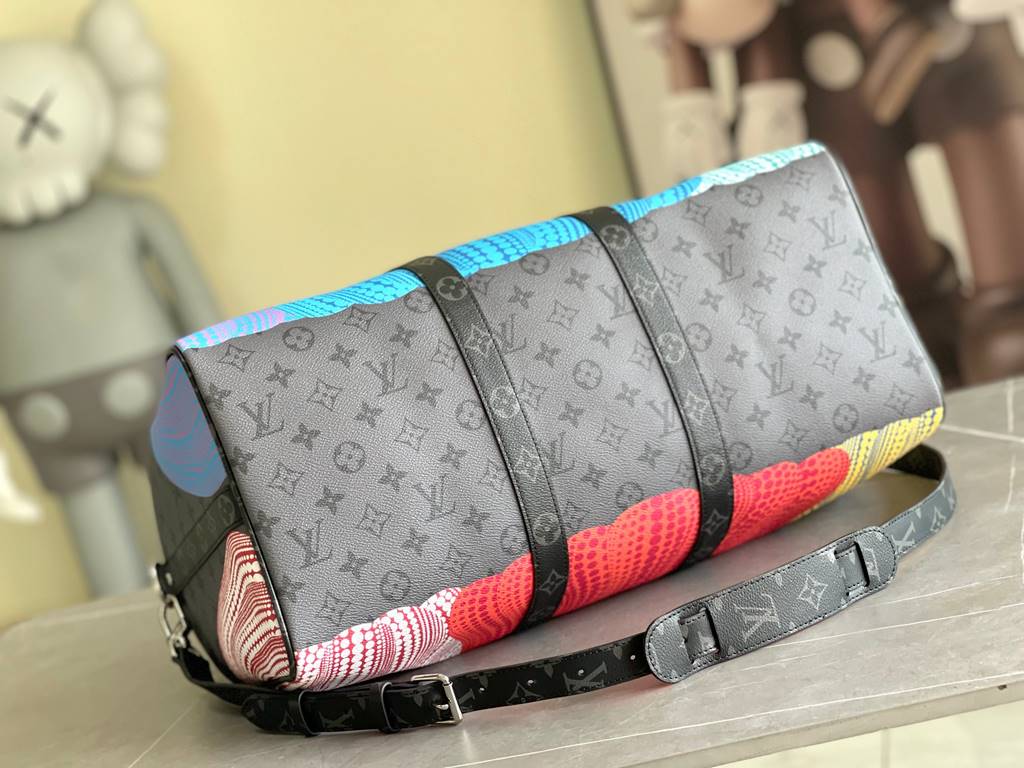 M46471, M46441 The hottest of the year, this Lv X YK Keepall 45 combines classic design with iconic details. Crafted from Damier Graphite canvas and sized for hand luggage. Featuring rounded leather handles and an adjust